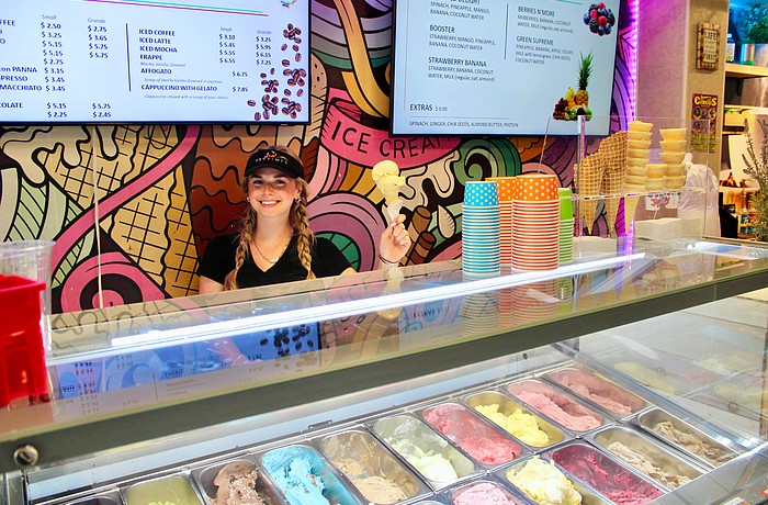 Olivia Swanson dishes up a scoop of passionfruit gelato on her last day at Settimi's Gelato before she heads off to college for a new school year.