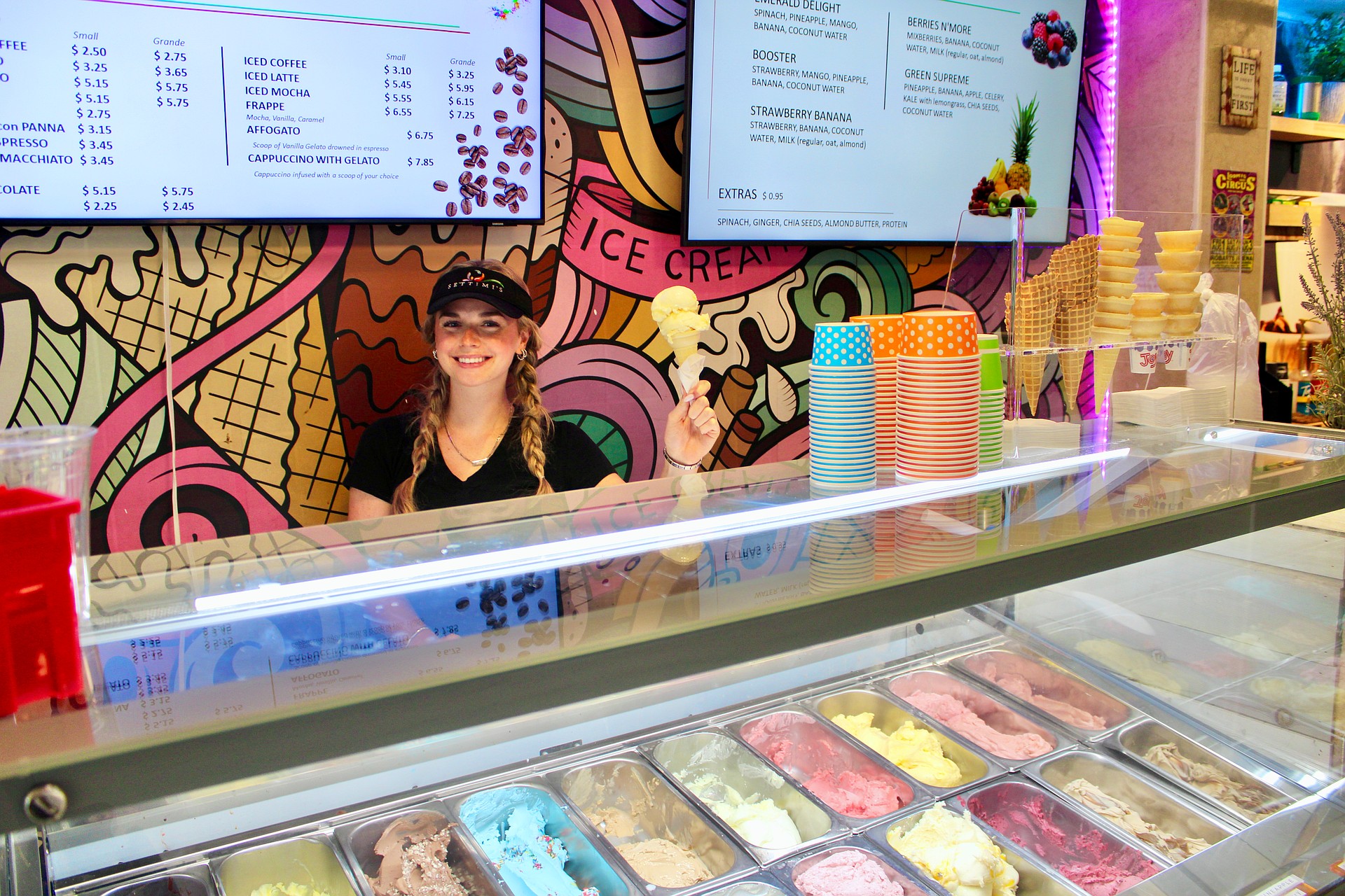 Olivia Swanson dishes up a scoop of passionfruit gelato on her last day at Settimi's Gelato before she heads off to college for a new school year.