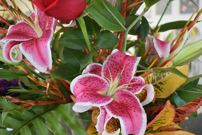 A bouquet of flowers is set out at the event.