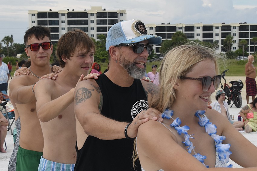 Finn Hammerl's brother Race Zoetmulder, friend Nate Neufeld, Luke Zoetmulder and friend Kristina Neufeld dance as part of a conga line.