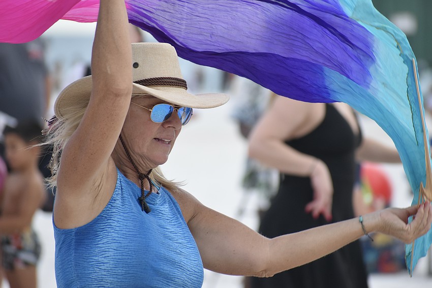 Vykky Contreras dances with a cloth.