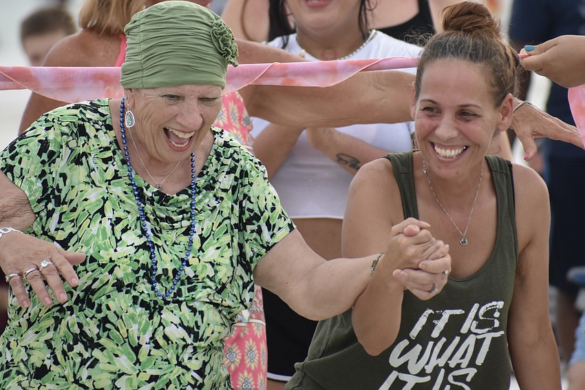 Frances Chandler and Chandler Stevenson do the limbo.