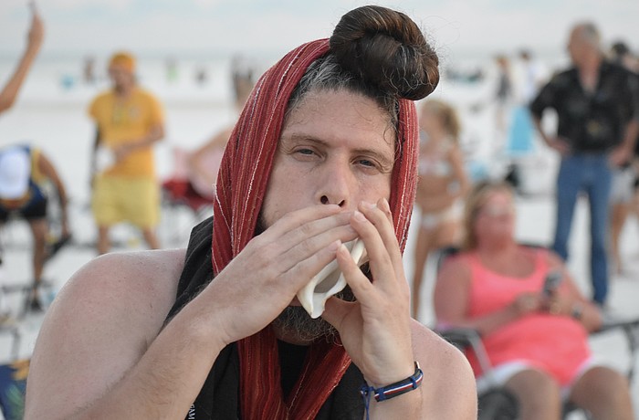 Jose Angel Figueroa Jr. makes music in the circle.