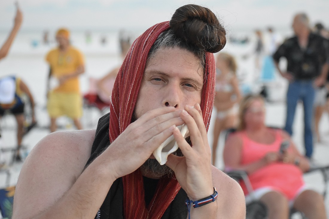 Jose Angel Figueroa Jr. makes music in the circle.