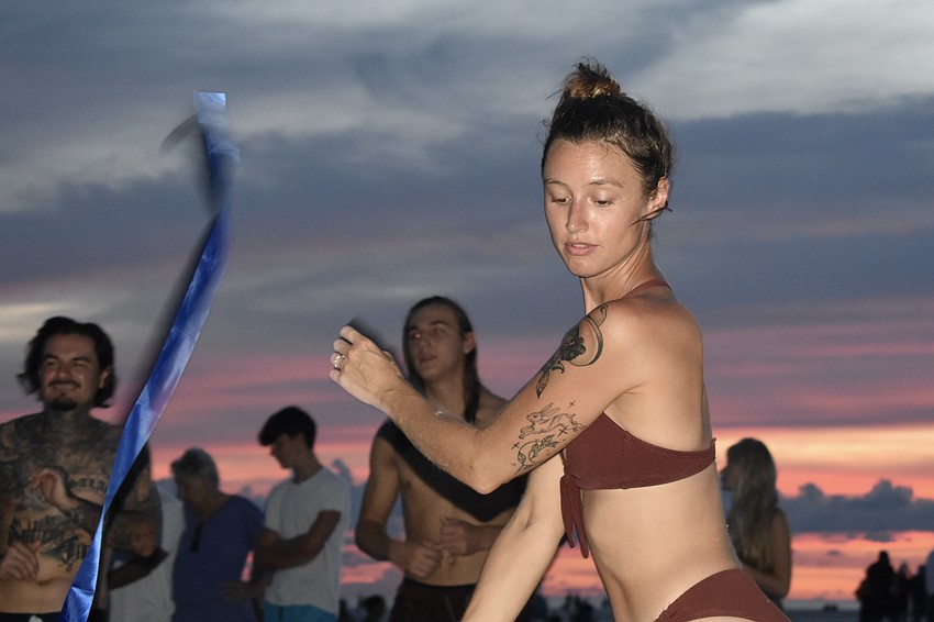 Teala Marie dances with a ribbon.