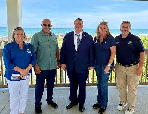 Flagler County Coastal Engineer Ansley Wren-Key, Deputy County Administrator Jorge Salinas, County Administrator Heidi Petito and Commission Chair Andy Dance took U.S. House District 6 Rep. Randy Fine (center) on a tour of the county's 18 miles of coastline on Aug. 13. Courtesy photo/Flagler County