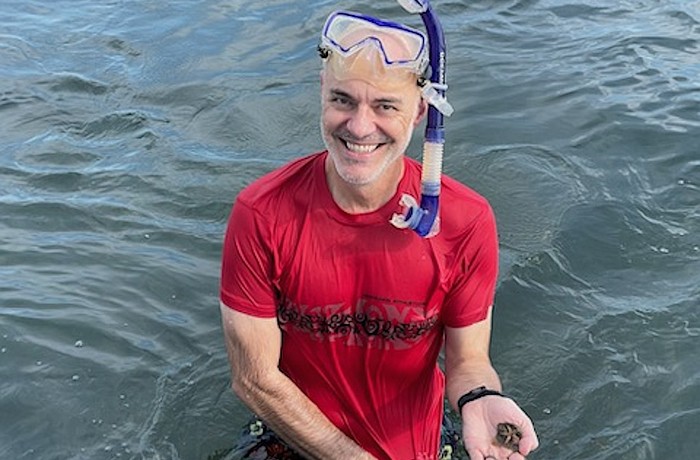 Corey Vandenhoe snorkeling during the Great Scallop Search