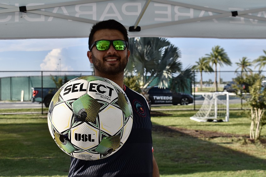 Adam Altman, account executive for the Sarasota Paradise, greets guests at the Premier Sports Campus Aug. 19 for Sarasota Paradise Day.