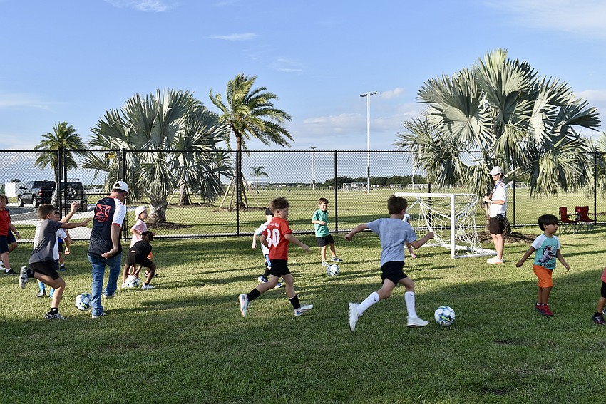 Soccer balls keep the kids entertained.