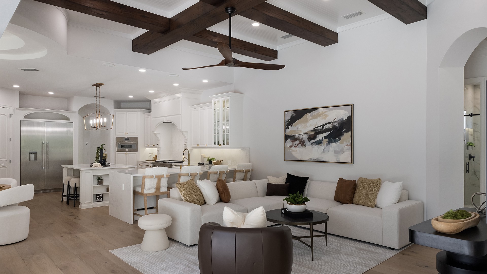 The kitchen and family room have been reborn in a contemporary style, showcasing a new coastal look.