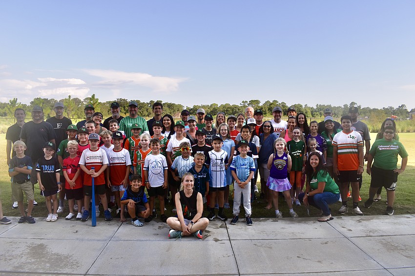 Lakewood Ranch Little League coaches, players and parents gather at the Lakewood Ranch Library Aug. 18, 2025 to show support for Manatee County's plans to build three ball fields at Country Club East Park.