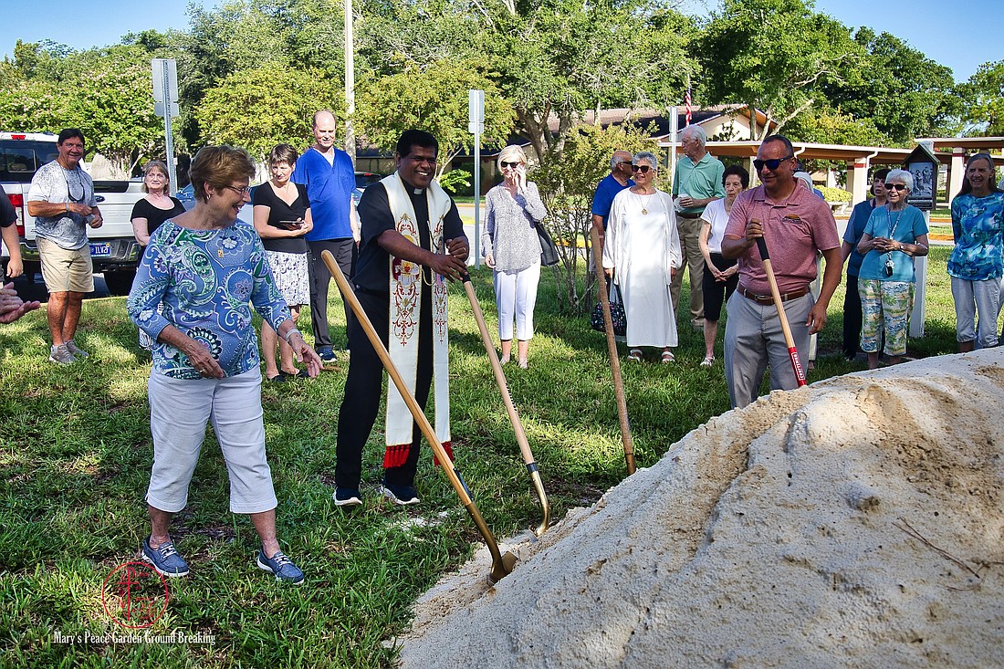 Prince of Peace Pastor Justin Vakko (second from left) celebrates the groundbreaking of the new Mary's Peace Garden. Photo courtesy of Prince of Peace Catholic Church