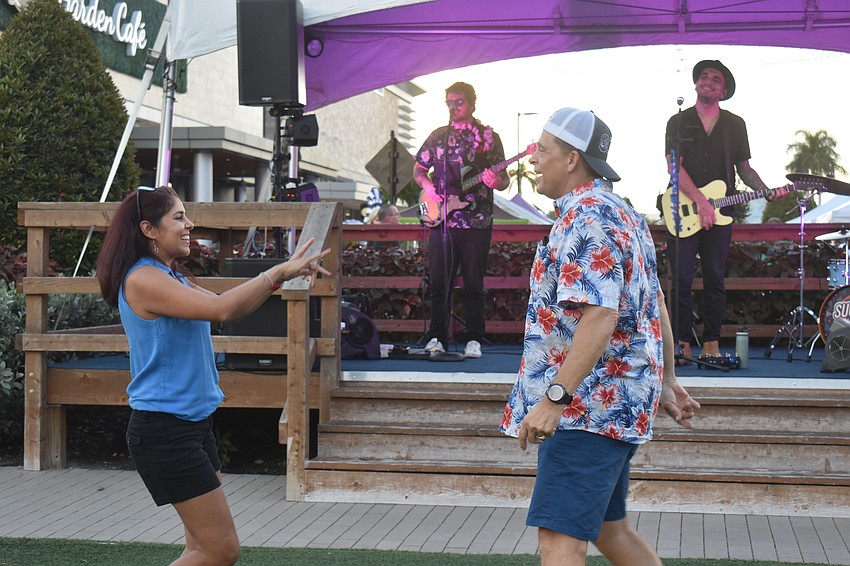 Grewhawk Landing's M Rattu and Tim Lorenz dance to the song to “As It Was” performed by Orlando based band Sugar Vibe. Lorenz says 