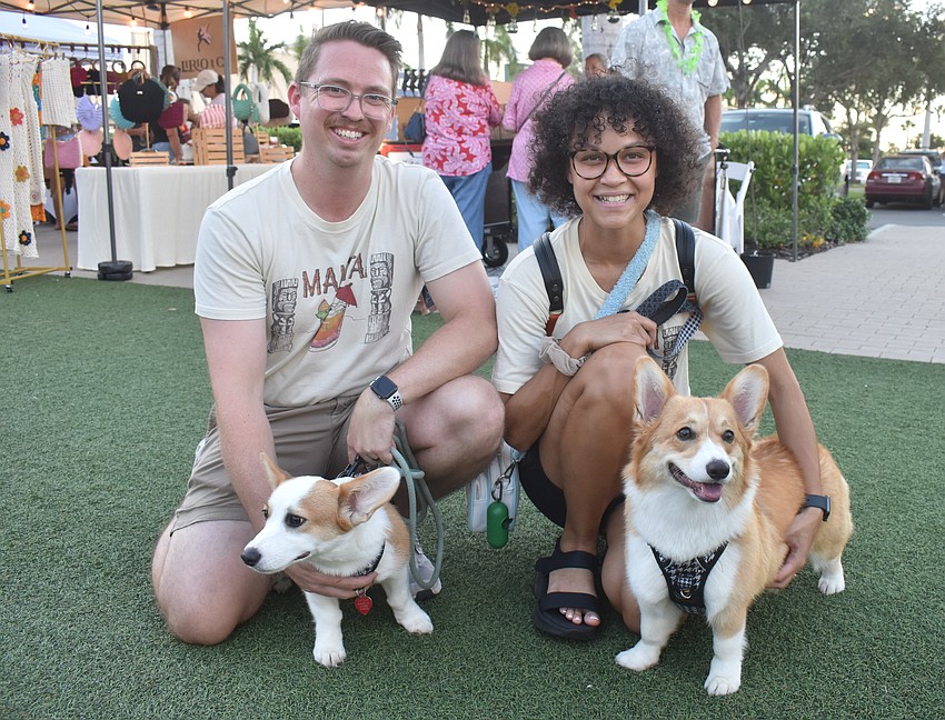 Parrish's Zachary and Naomi Kleer bring their dogs, 6-month-old Macha and 1-year-old Mochi to the Hawaiian themed market.