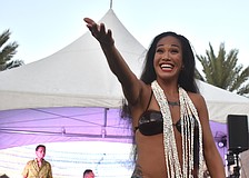 Kawailana Vaiaoga of Aloha Productions invites women and children up to dance.