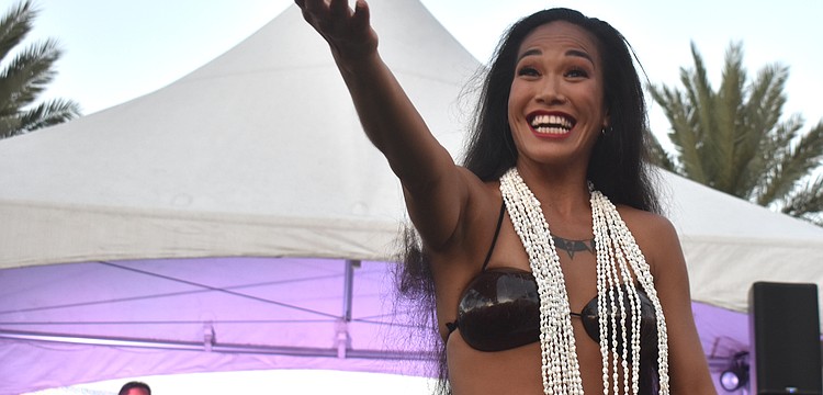 Kawailana Vaiaoga of Aloha Productions invites women and children up to dance.