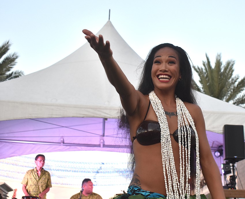 Kawailana Vaiaoga of Aloha Productions invites women and children up to dance.
