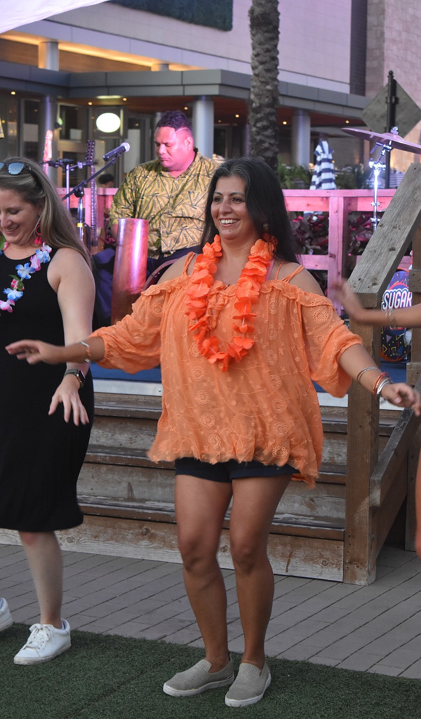 Sarasota's Angela Ortega is among the community members who got up to dance. She said as someone from Colombia, she loves music from everywhere.
