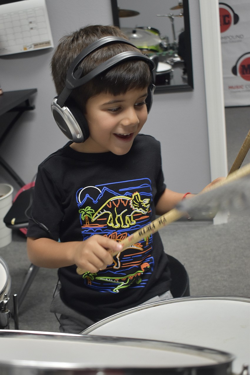 Daniel Garcia, 4, plays the drums.