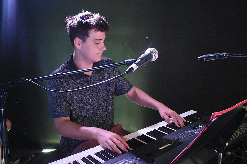 Matthew Varley, 16, plays the keys during the performance by Solar Apocalypse.
