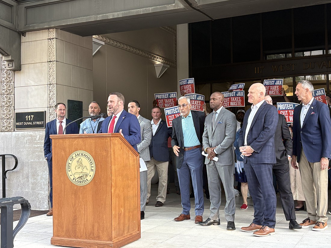Jacksonville City Council President Kevin Carrico holds a news conference Aug. 25 at City Hall calling for a cut in the city's millage rate. He was backed by eight council members including, from left, Joe Carlucci, Mike Gay, Raul Arias, Ron Salem, Terrance Freeman, Nick Howland and Chris Miller.
