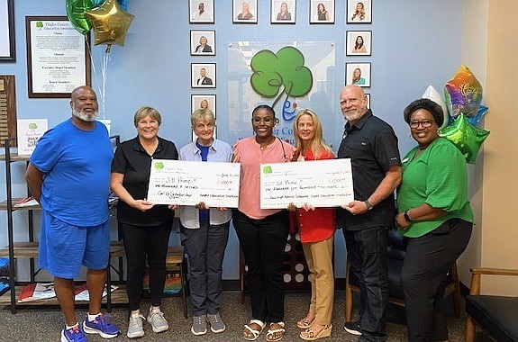 Jill Prime (center) received renewals for her senior scholarships from Quantum Electrical Contractors and the Girl Up! Foundation. Courtesy photo