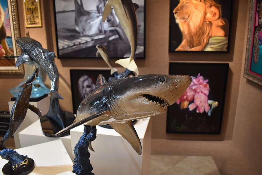 A Wyland sculpture of a shark is dispalyed in the gallery.