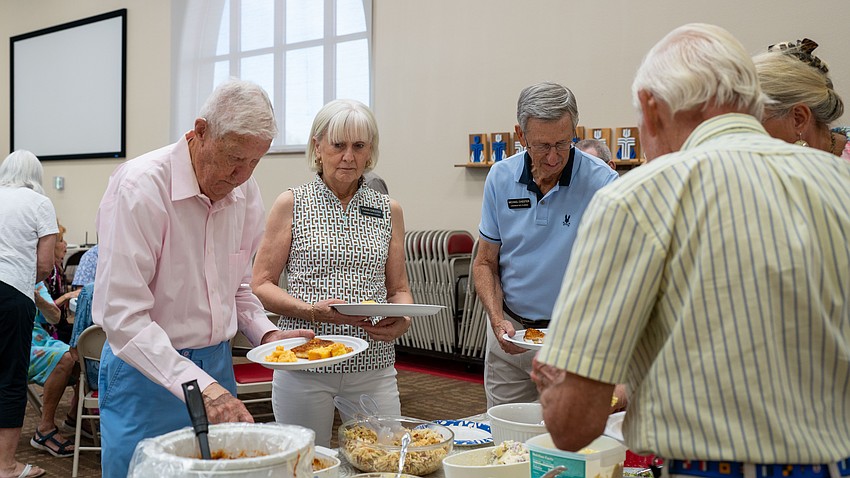 Jerry Fox helps himself at Christ Church of Longboat Key's annual fish fry Thursday, Aug. 27.