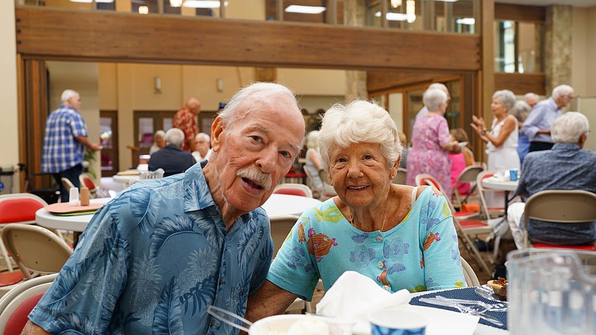 Joe Deugenio and Patty Buck pose for a photo at Christ Church of Longboat Key's annual fish fry Thursday, Aug. 27.