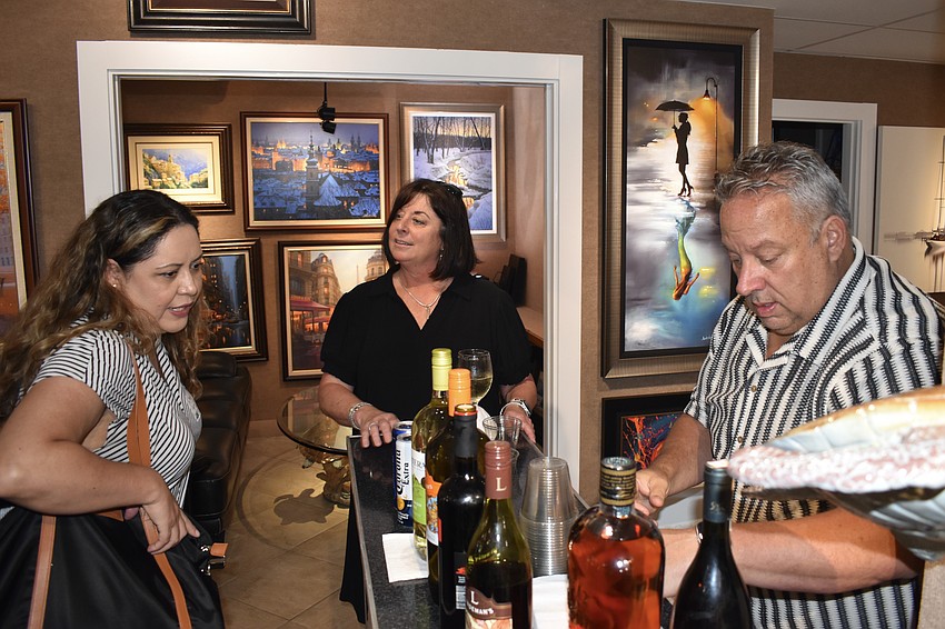 Su Morales greets Kim Vincent and her brother Shawn Walters.