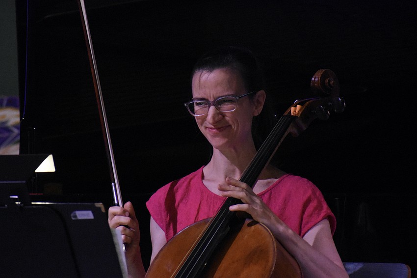 Nadine Trudel finishes a piece on the cello.