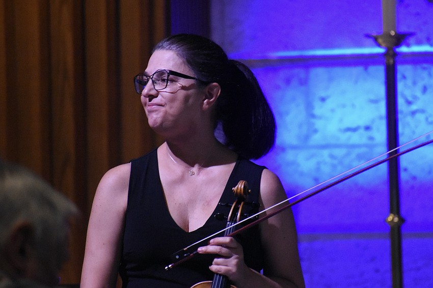 Milene Moreira finishes a piece and prepares to take a bow.