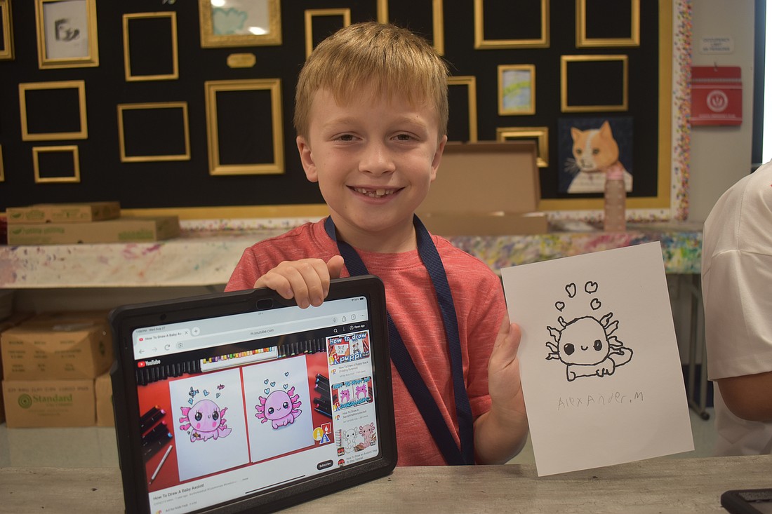 Third grader Alexander Muenchow chose to draw an axolotl. He says he enjoys using special tools on the iPad that may not be in the classroom such as a glitter tool and stickers.