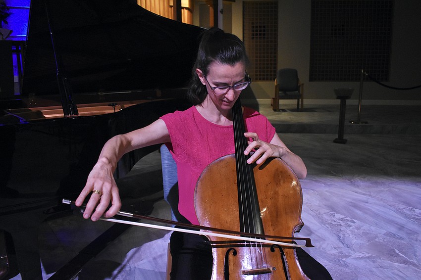 Nadine Trudel demonstrates the cello.