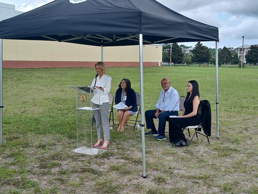 Jacksonville Mayor Donna Deegan announced the city's Express Lane Permitting process Aug. 28 at in a grassy lot where a grocery is planned at the Atlantic North shopping center in East Arlington. Behind Deegan, from left, Nina Sickler, Director of Public Works; shopping center developer Toney Sleiman; and Sabrina Dugan, managing partner and co-founder of Swiftbuild.ai.