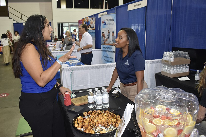 Meghan Falero of Entech talks with Sydney Johnson of University Park Country Club.