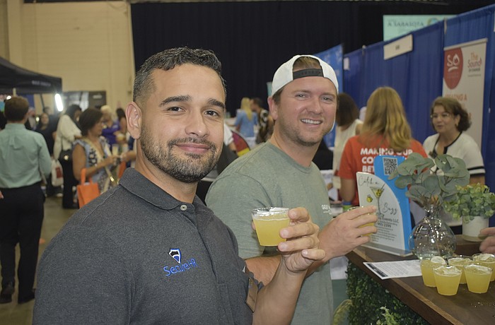 David Figueroa of Secure HR and Jorge Valdes of Golf Therapy Club enjoy the event experience.