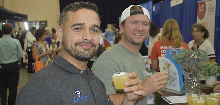 David Figueroa of Secure HR and Jorge Valdes of Golf Therapy Club enjoy the event experience.