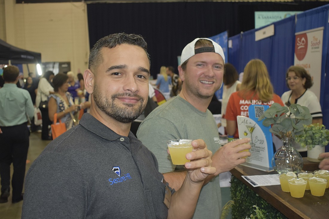 David Figueroa of Secure HR and Jorge Valdes of Golf Therapy Club enjoy the event experience.
