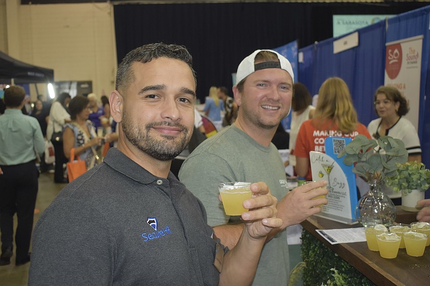 David Figueroa of Secure HR and Jorge Valdes of Golf Therapy Club enjoy the event experience.