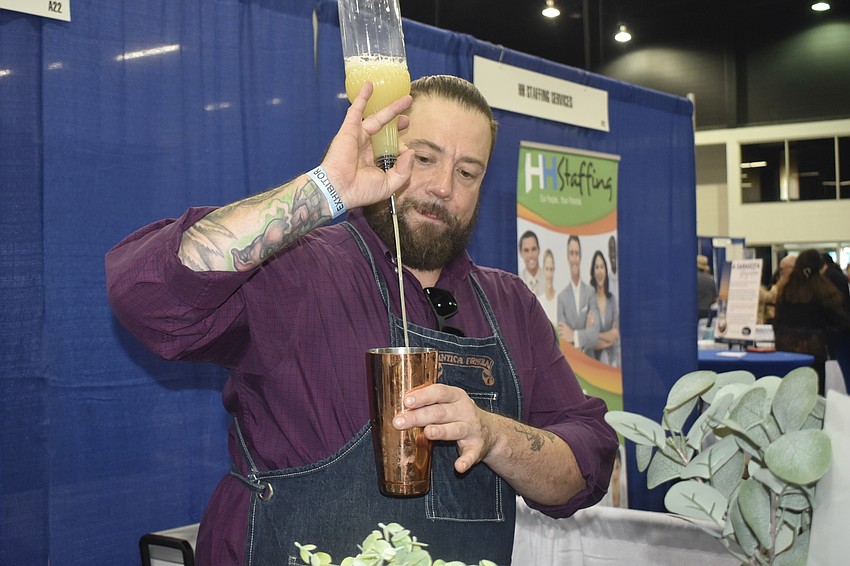 Michael Scalzi of Catch a Buzz Events pours a drink.