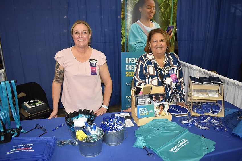 Emily Williams and Victoria Canales staff the Midflorida Credit Union table.