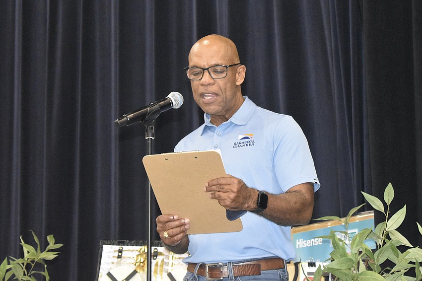 Director of Government Affairs Marlon Brown announces a set of prize winners.