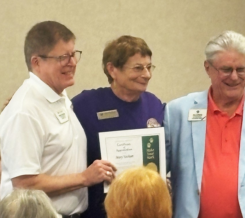 OBTS Lion Mary Yochum (middle) receives a Presidential Certificate from Past International Director Robert Littlefield (left)and Past International Director Neil Spencer (right). Courtesy photo