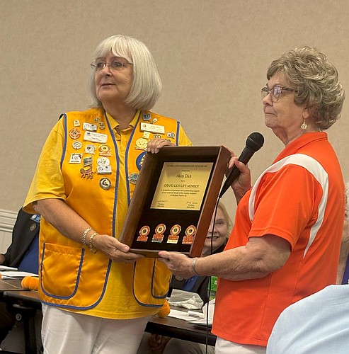 OBTS President Aleta Dick accepts her Grand Lion Life Membership from Past District Governor Vivian Henegar. Courtesy photo