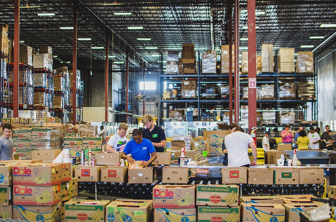Volunteers sort food donations inside Second Harvest Food Bank of Central Florida's main distribution center in Orlando, Florida. Courtesy photo