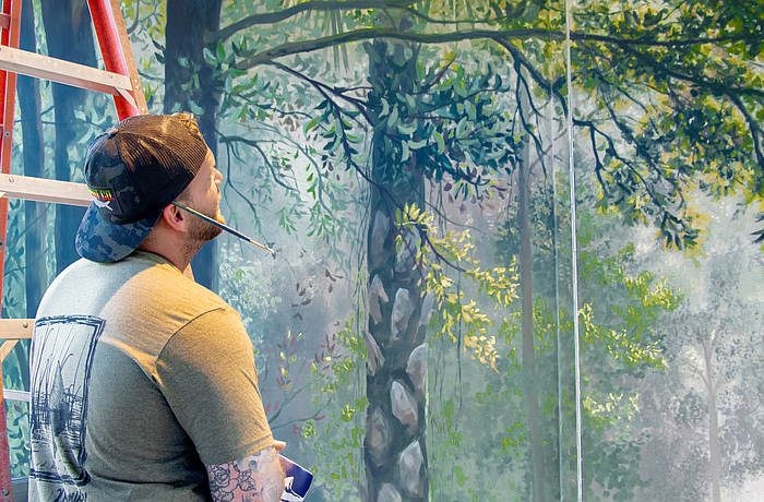 Artist Andrew Viera has been working on seven murals at Mote SEA since April 2024.