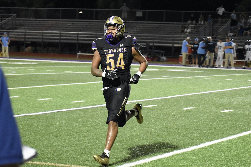 Senior Jaleel Williams runs across the field.