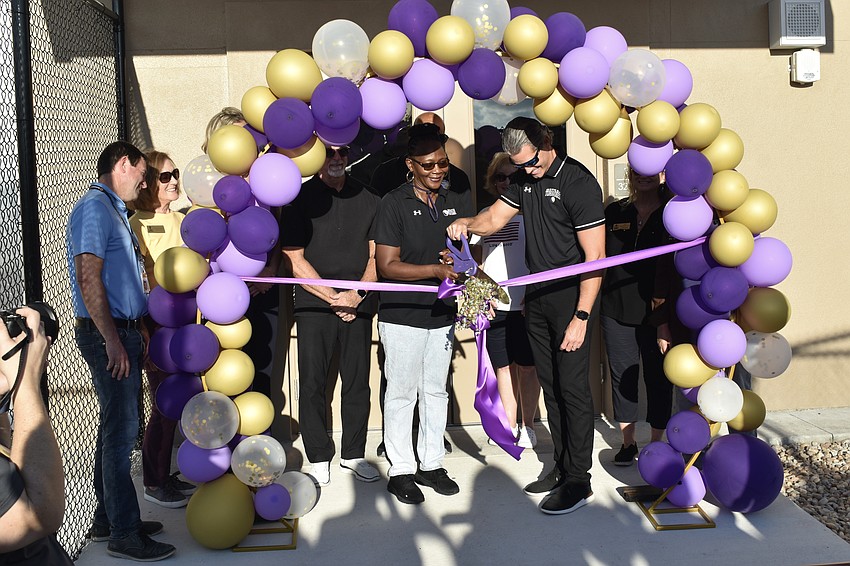 Principal Rachel Shelley and Superintendent of Schools Terry Connor cut the ribbon on the new field house.
