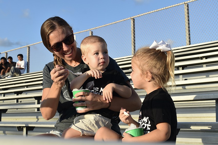 Jordan Myers and her children Madden Myers, 1, and Bailee Myers, 4, enjoy treats from Kona Ice.